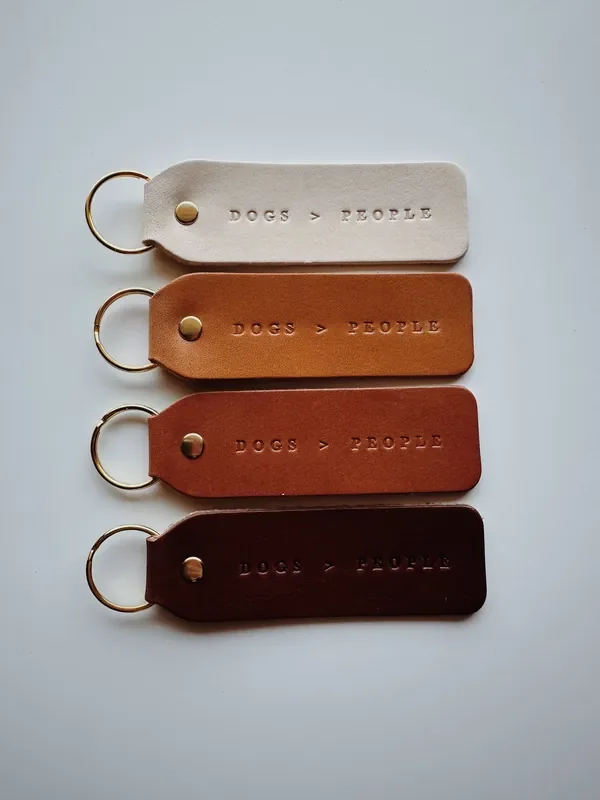“Dogs > People” Leather Keychain