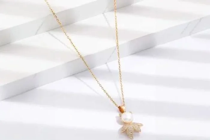 Elegant Gold Leaf Man with Pearl Pendant Necklace